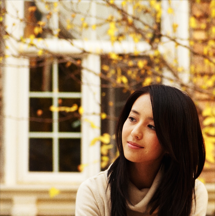 a photo of a Chinese woman looking off to her right