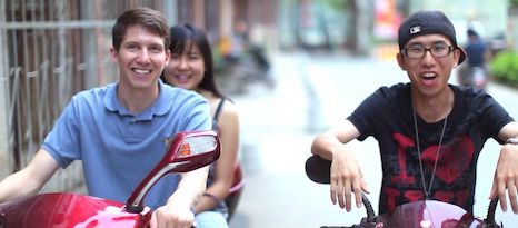 three people riding mopeds in China