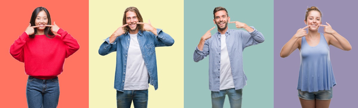 Composition of hispanic, white and chinese group of people over vintage color background smiling confident showing and pointing with fingers teeth and mouth